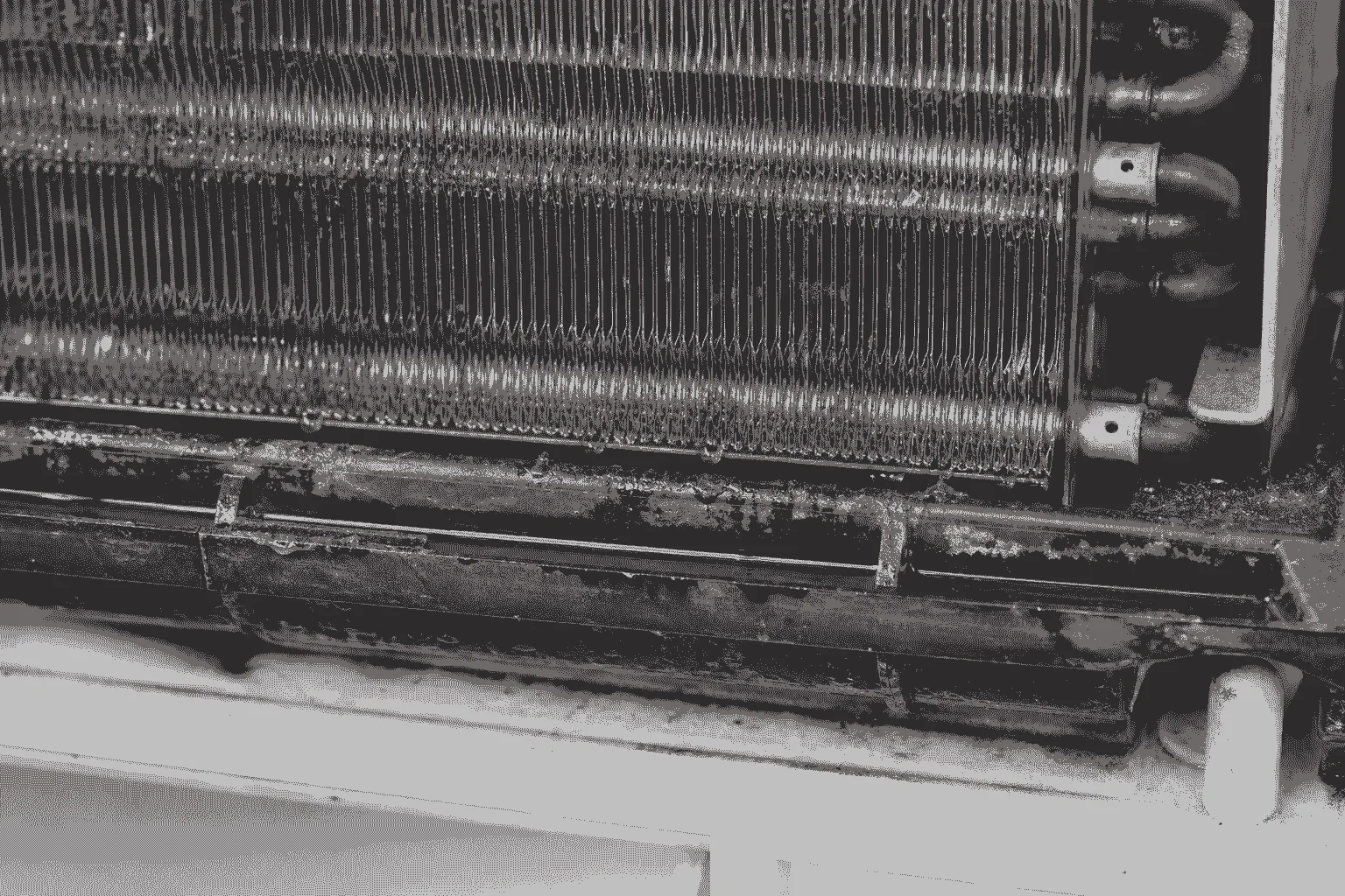 Seasonal AC tune-up inspection checking moisture and buildup inside an air conditioning system in Pace